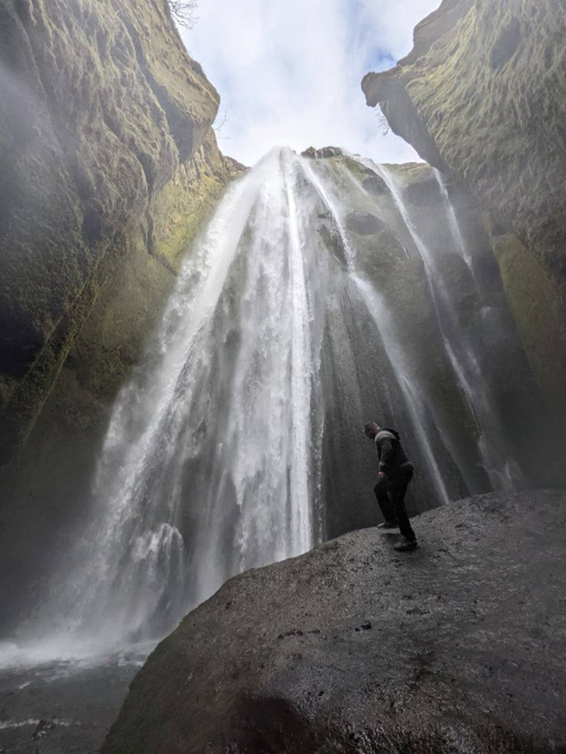 US student by Gljufrabui waterfall